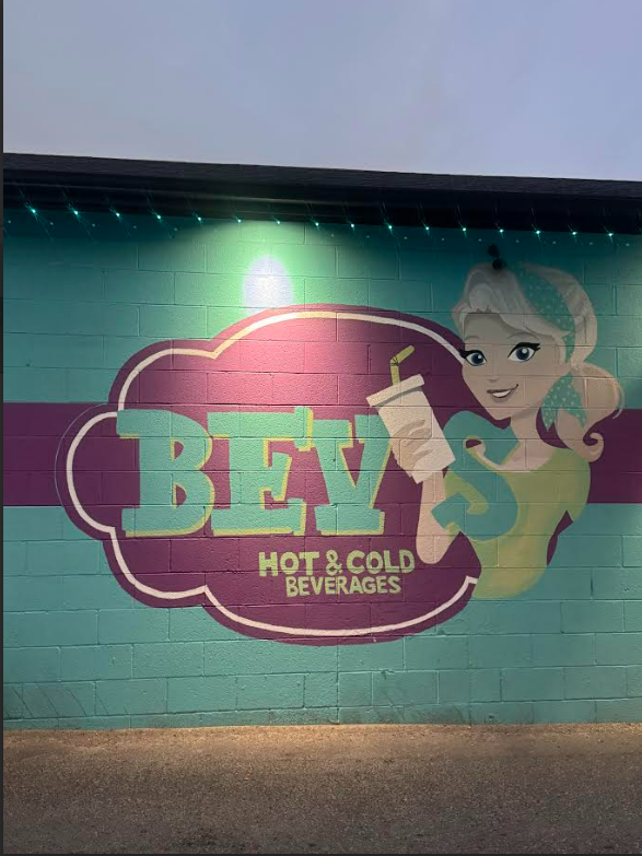 Bev's Hot & Cold Beverages mural painted on a teal cinderblock wall in Nephi, Utah