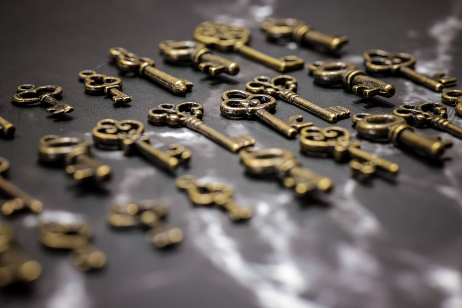 A close-up of brass keys and small vintage objects