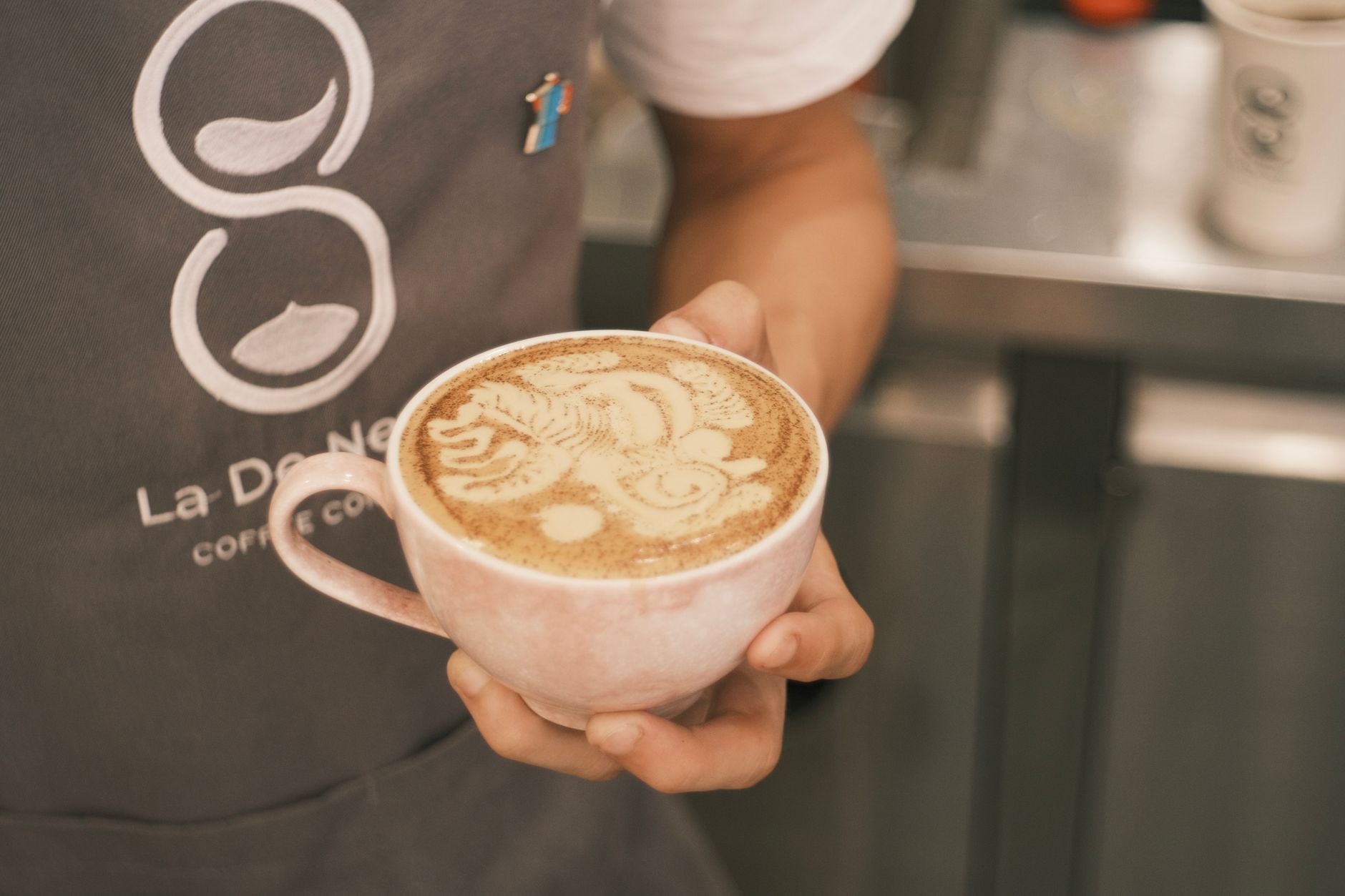 Specialty coffee drink with latte art in a ceramic cup