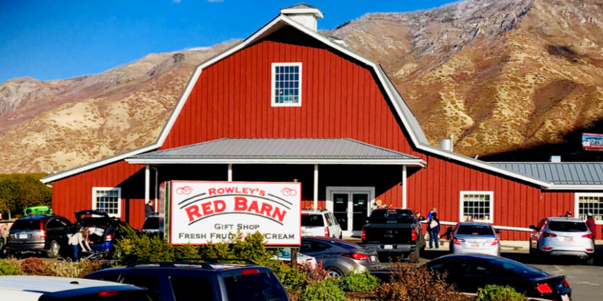 Rowley's Red Barn in Santaquin, Utah, a red barn farm stand with mountains in the background